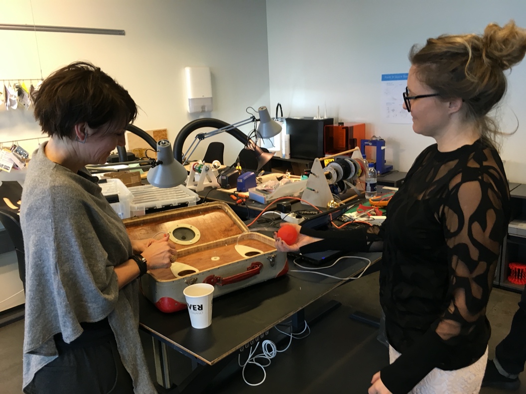 A person standing in front of a computerDescription automatically generated